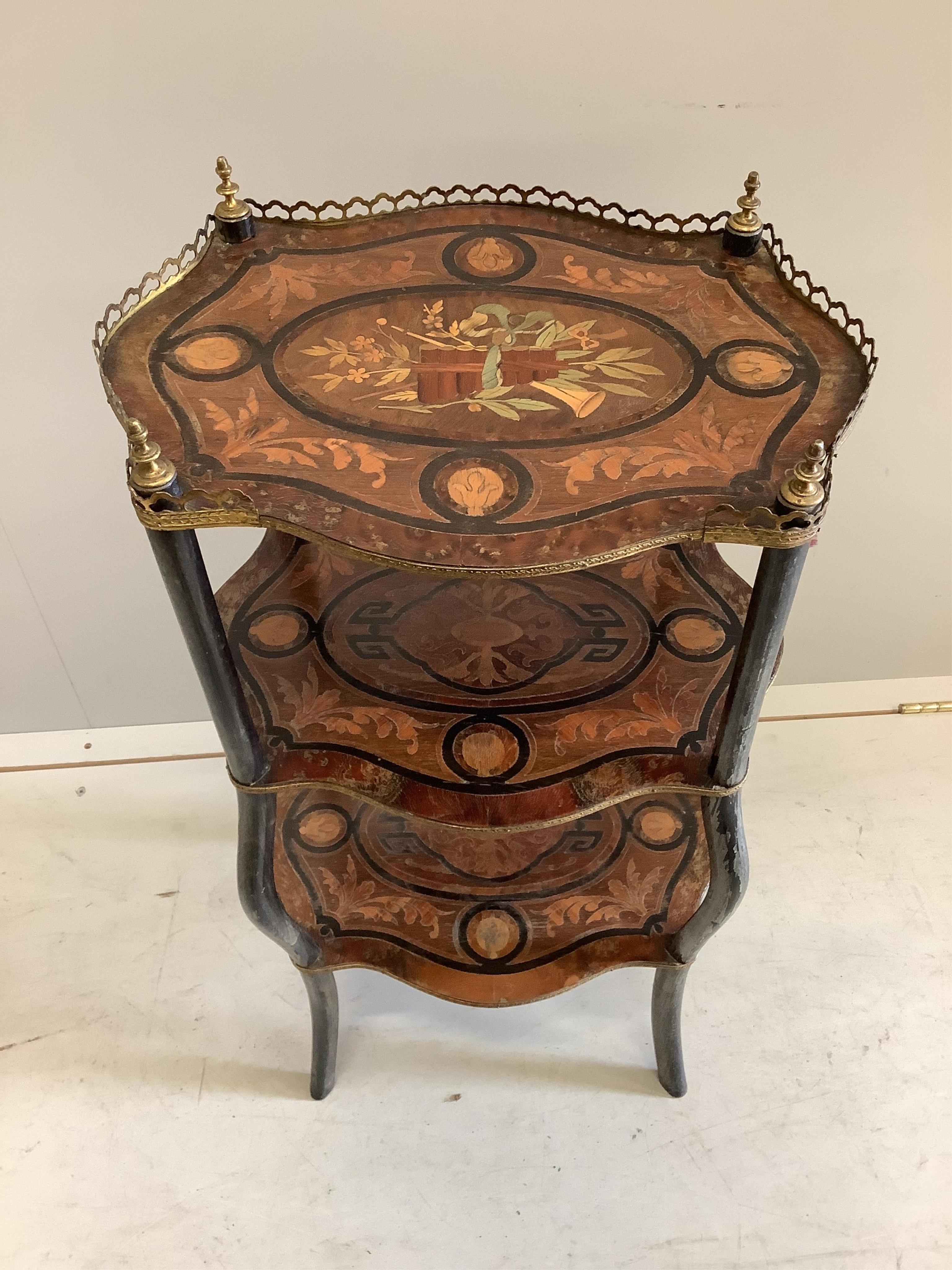 A Napoleon III marquetry inlaid three tier etagere, height 79cm. Condition - fair